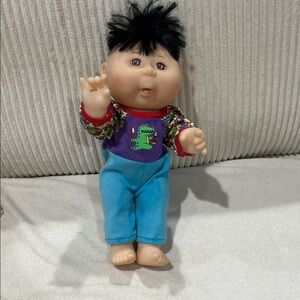 Brushing  teeth Mattel Cabbage Patch Doll with Blue Outfit and Black Hair